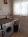Utility room off kitchen includes a range of cupboards, granite worktop,  tumble drier and washing machine. There is a utility sink with hot and cold water and a door to the terrace and garden.